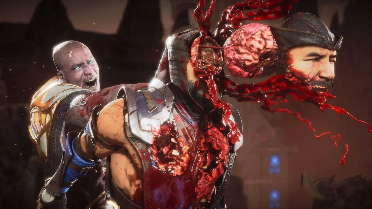 erlebnisse-mit-rollenspielmudigkeit-und-der-entdeckung-von-mortal-kombat-11_img_2 | etalongame.de Mortal Kombat 11 Videospiel-Screenshot, in dem ein Charakter einem anderen das Gehirn ausschlägt, wobei die Hälfte seines Schädels wegfliegt, um es zu enthüllen.